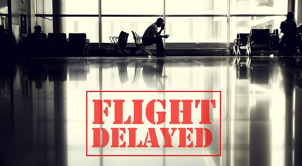 Airport Chaos 01 flight delayed person in airport terminal