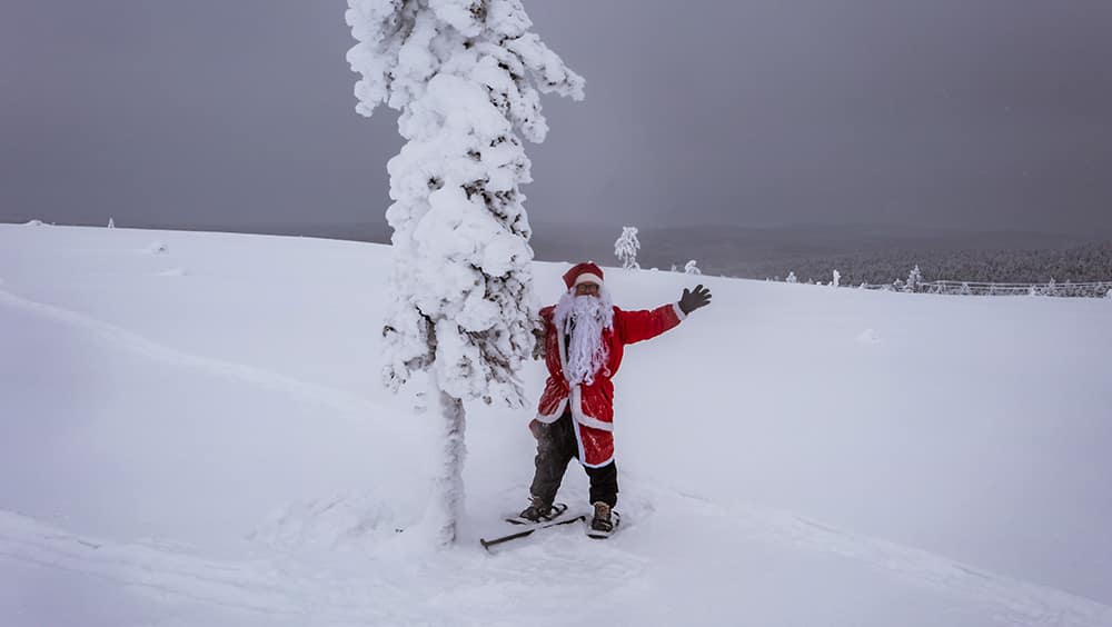 Finding Santa Father Christmas in snow wilderness