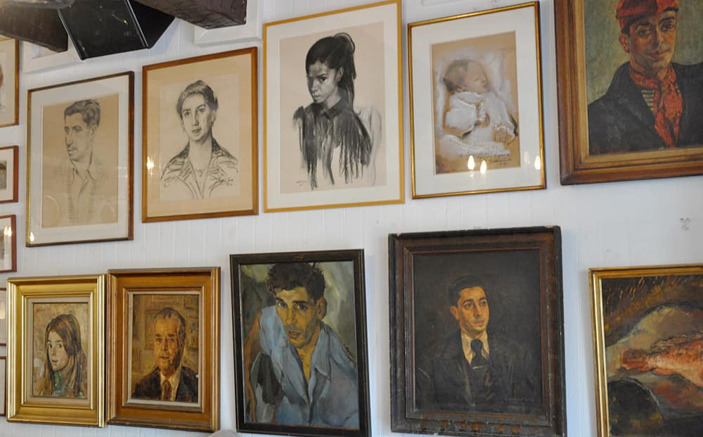 Some of the original paintings displayed in the Cafe des Templiers in Collioure