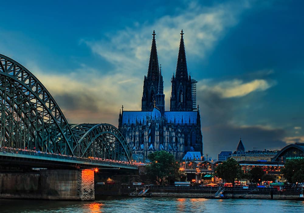 International train travel Cologne cathedral railway bridge over the Rhine