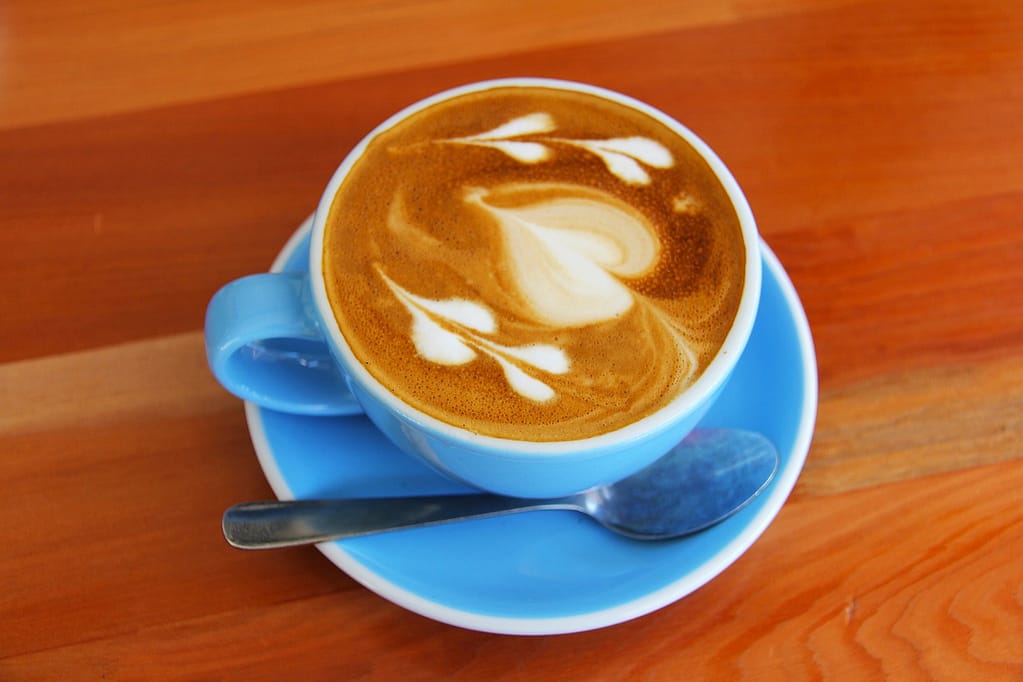 Coffee cities flat white in blue cup