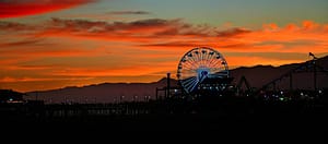 Where in the World 650 featured image ferris wheel against orange sunset